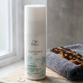 Wella Nutricurls Curlixir Balm — Defining Balm for Curls

Reveal your most defined, bouncy curls with this intensely nourishing leave-in balm. Curlixir acts as the perfect primer to prep and perfect your curl pattern — delivering soft hold, frizz control, and lasting definition without stiffness.